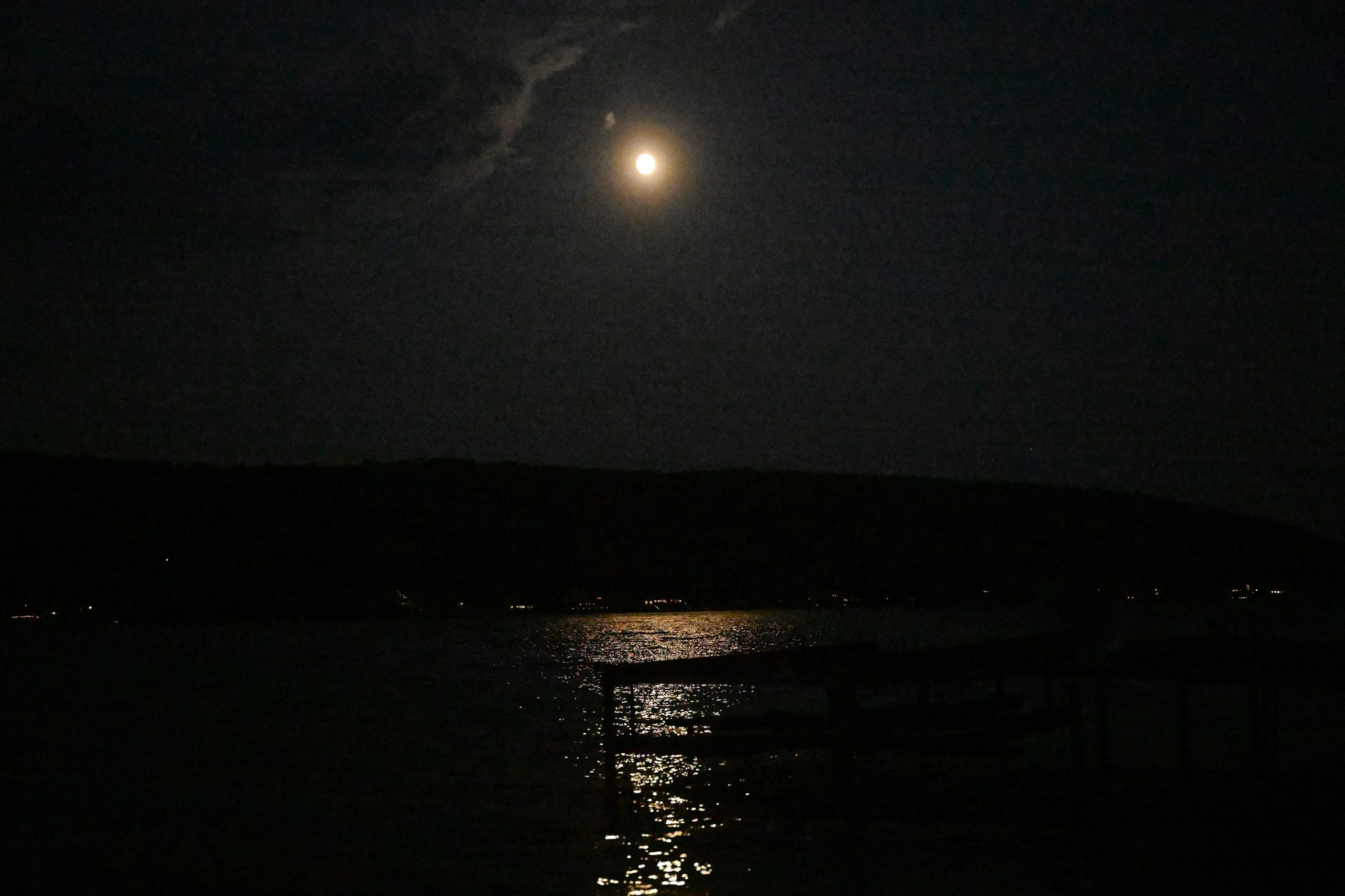 Full moon rising over Waneta Lake at night