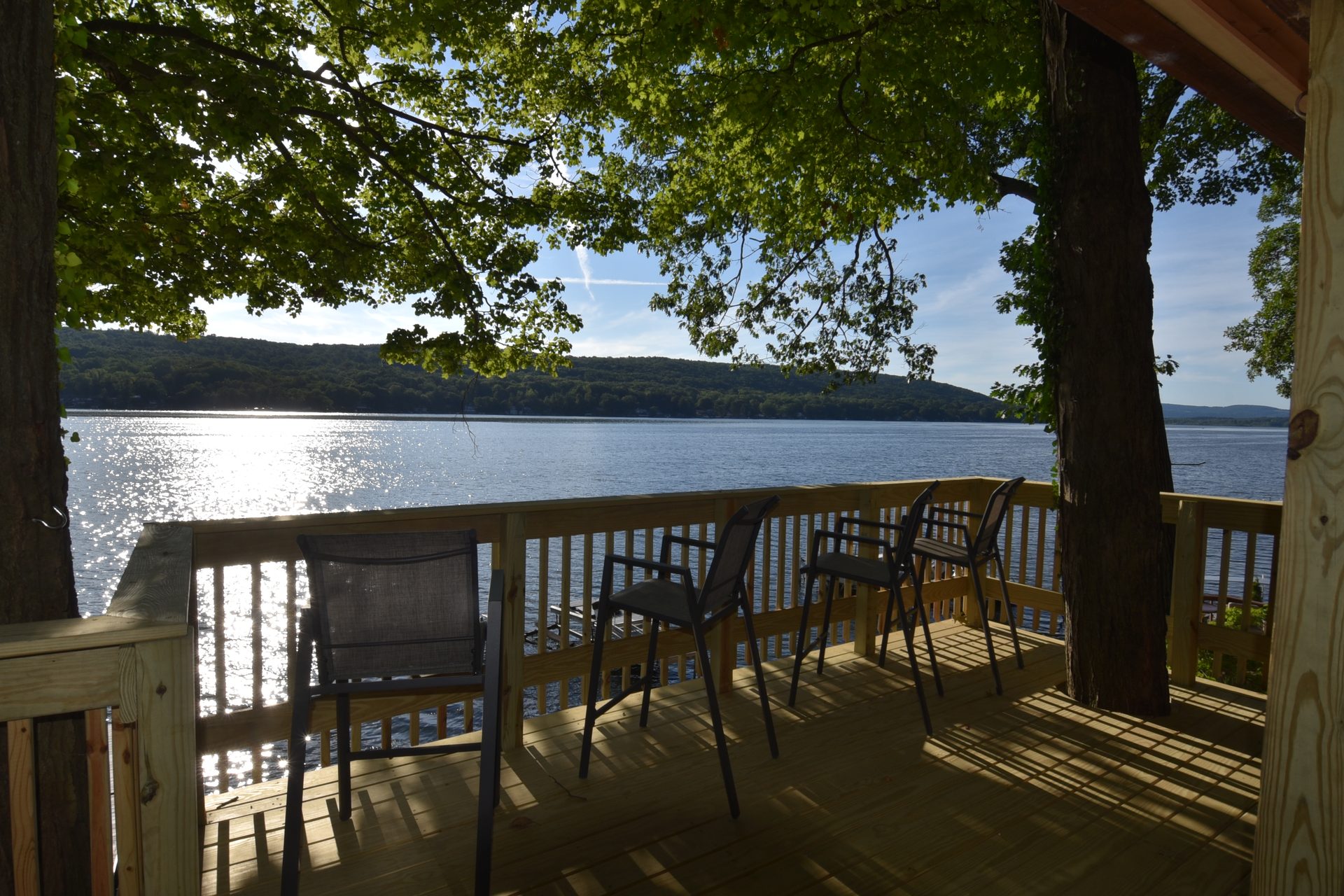 The deck overlooking Waneta Lake on a sunny day